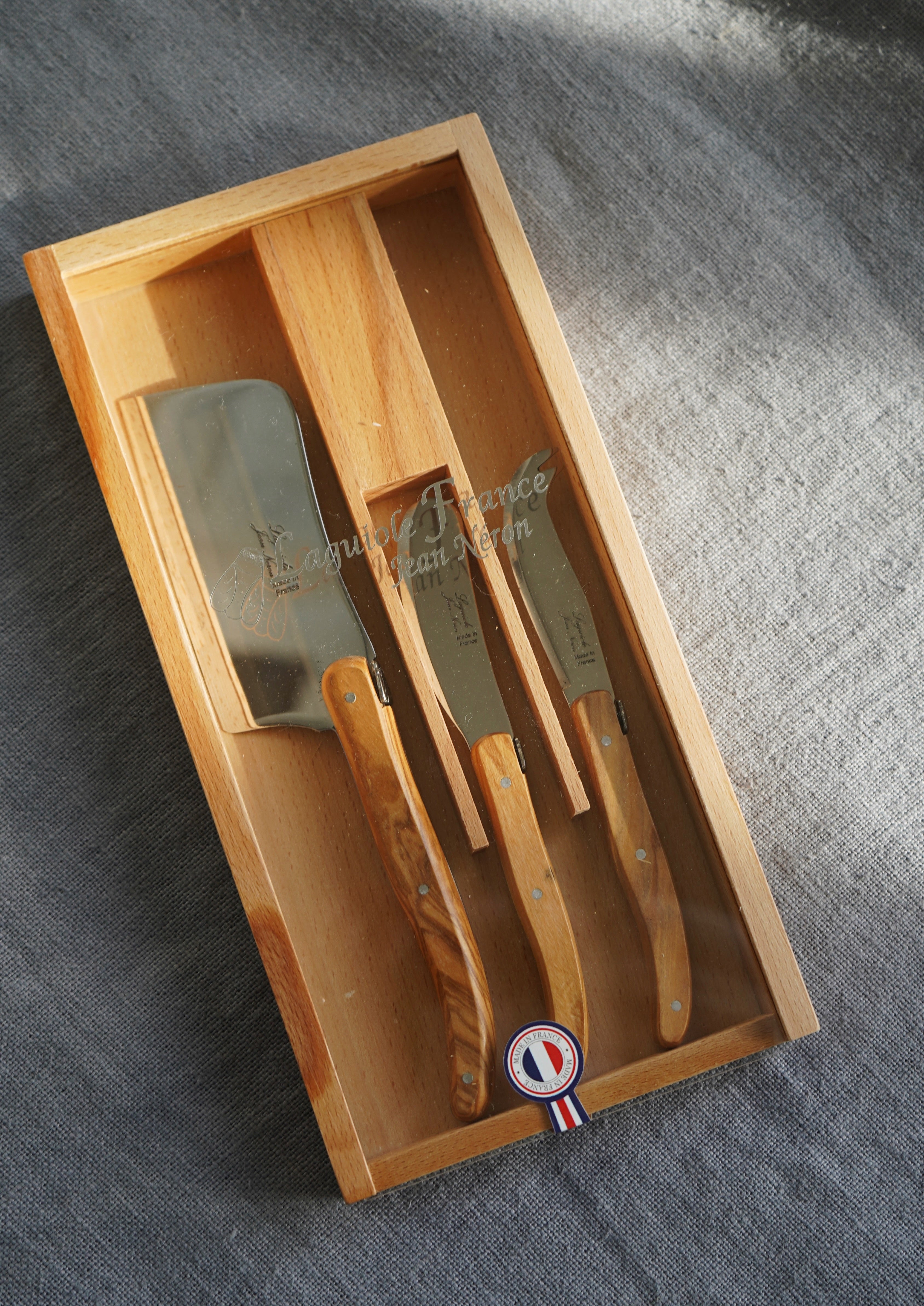 Laguiole Olivewood Large Cheese Set in Wood Box with Acrylic Lid (Set of 3) Cutlery Set Laguiole Brand_Laguiole Kitchen_Dinnerware Kitchen_Serveware Knife Sets Laguiole New Arrivals Spring Collection 35898A98-E3A4-44F5-8AA5-E741DB217791